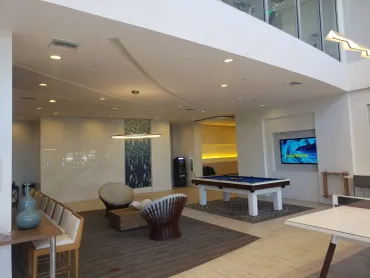 Curved finished ceiling soffit over a lounge and games area