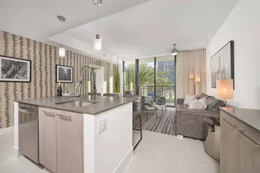 Finished ceilings and walls in a furnished apartment kitchen and living room