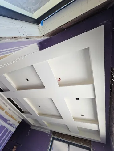 Coffered ceiling grid finished in smooth white drywall