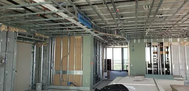 Ceiling grid and metal stud partitions framed on an open floor plate